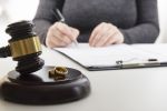 Meeting with a lawyer with a gavel and wedding bands
