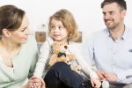 Child Support Concept - Family with daughter in forefront