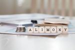 Word ALIMONY composed of wooden letters. Visual concept for a divorce law blog discussing Utah alimony laws.
